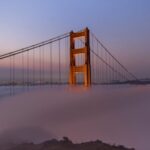 Golden Gate bridge spires rising above the fog north of San Francisco.