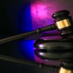 Gavel lit in blue and red, illustrating freight broker liability after the Montgomery ruling.